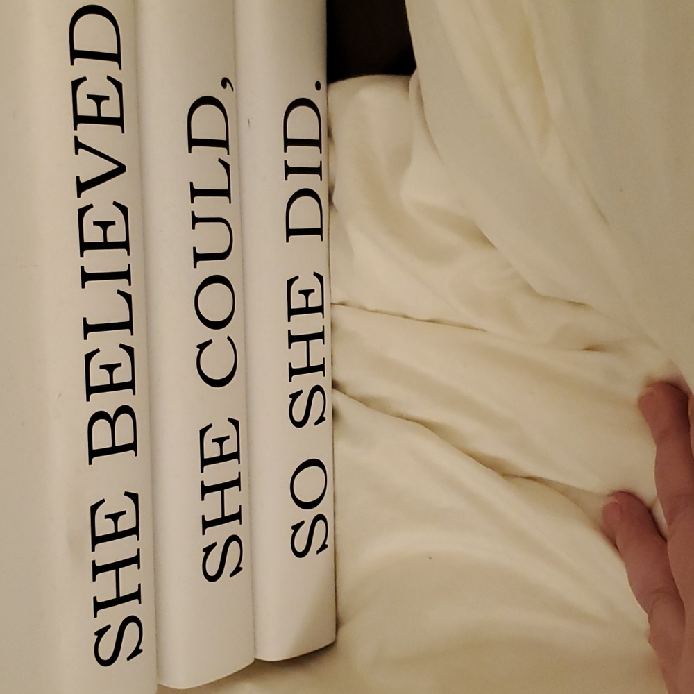 3 books whose spines create a saying